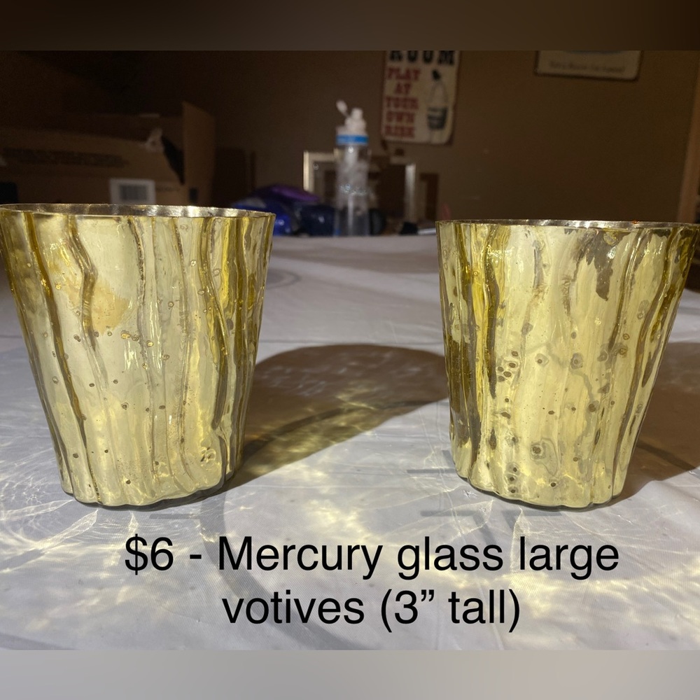 Two gold tone mercury glass votive candle holders